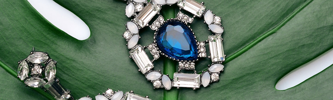 Diamond and sapphire drop earrings styled for a jewellery e-commerce case study