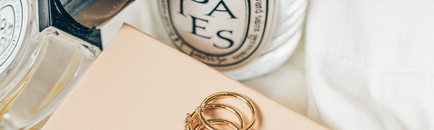 Gold rings displayed on a branded jewellery presentation box
