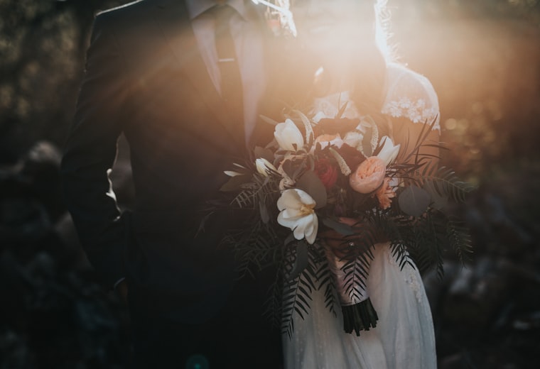 Bride holding a bridal bouquet wearing wedding jewellery — bridal jewellery website design