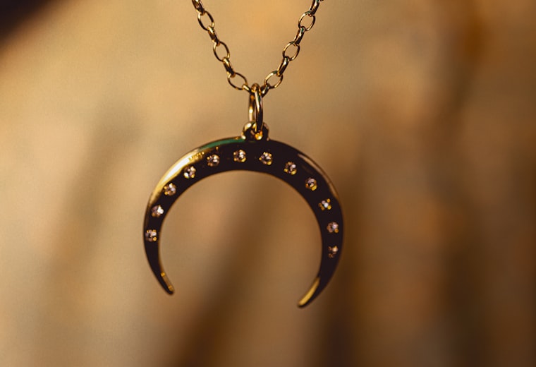 Gold pendant on a fine chain — gold jewellery website development by GK Digital