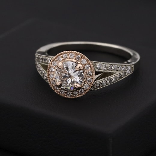 Main catalogue image of a solitaire diamond ring on a dark background